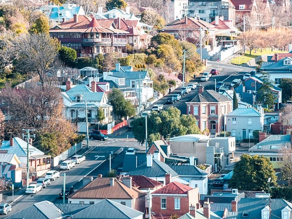 Hobart skyline with rental price trend graph overlay.
